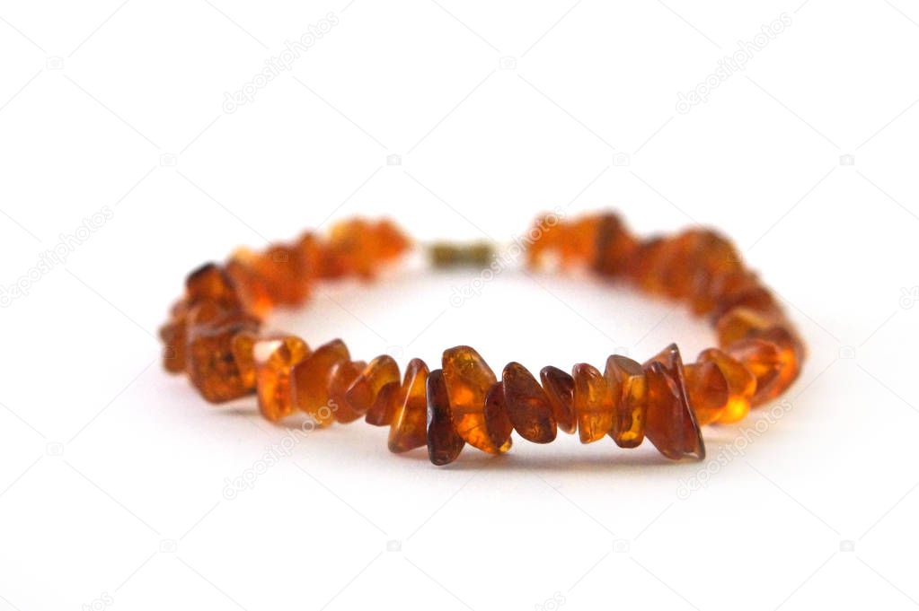 Amber bracelet, amber beads, amber stones, red amber, amber on white background, close-up, white background, headstock stock image, Nostalgishop