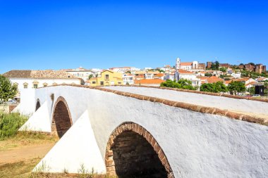 Roman bridge and medieval castle in Silves, Portugal  clipart