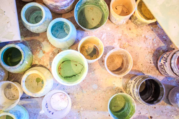 Paint containers in artistic studio — Stock Photo, Image