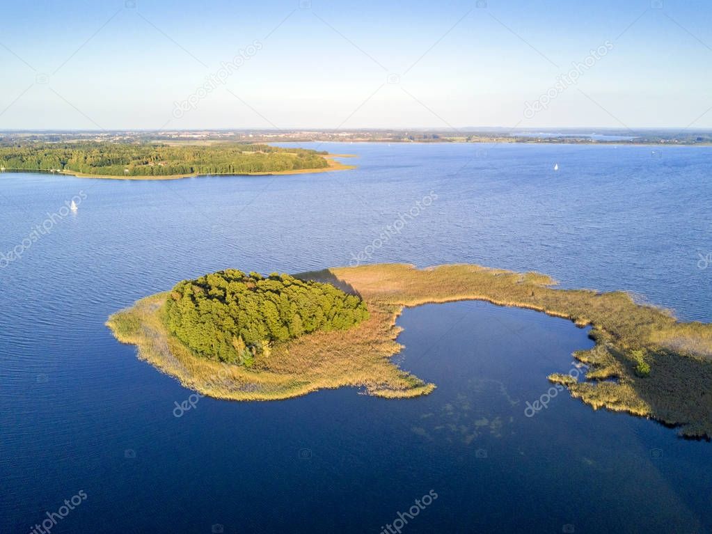 Small peninsula with pine trees, Mazury district lake, Poland
