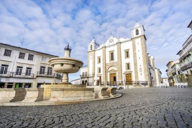 Giraldo Square with fountain and Saint Anton's church, Evora, Al clipart