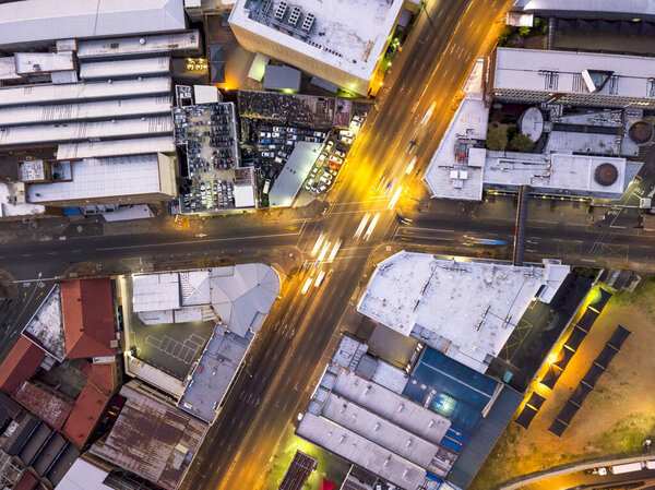 Aerial view of road crossing in Johannesburg illuminated by car traffic, South Africa