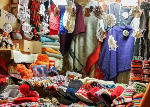 Stall with colorful woolen clothes at Riga Christmas market — Stock Photo, Image