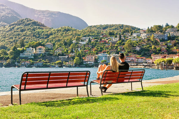 Couple sitting on bench in Ascona in Ticino of Switzerland