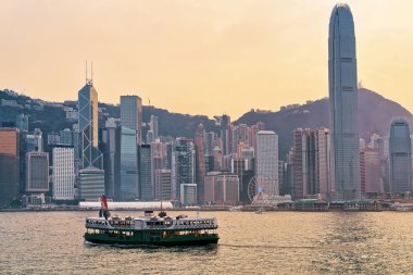 Star ferry at Victoria Harbor of HK at sundown clipart