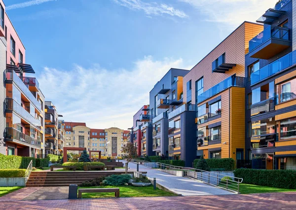 Modern complex of residential buildings and benches — Stock Photo, Image