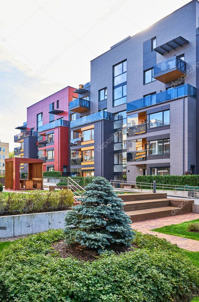 Modern complex of residential buildings and green trees