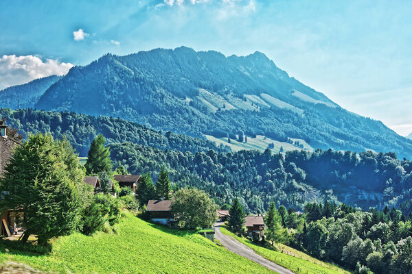 Panoramic view on Village on Prealps mountains in Gruyere district in Canton Fribourg in Switzerland