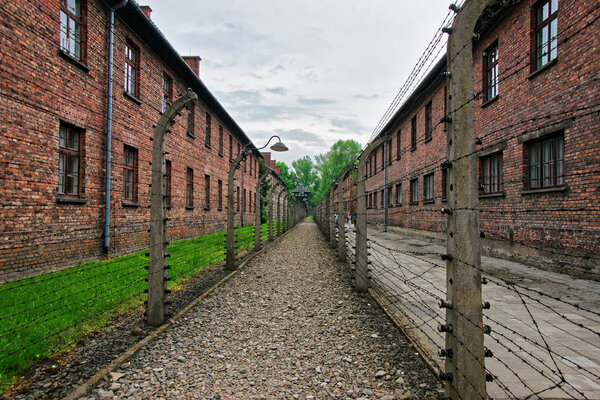 Barbed wire and barracks at Auschwitz concentration camp