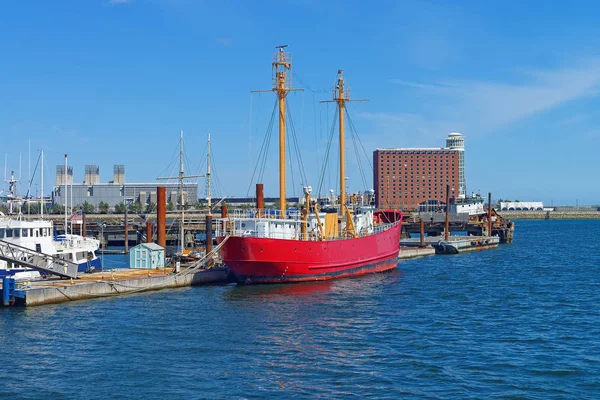 Moored red ship near pier at the bay in Boston