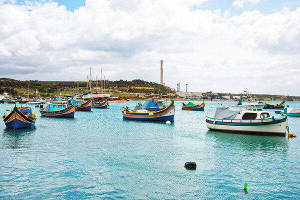 Luzzu colored boats at Marsaxlokk Harbor of Malta