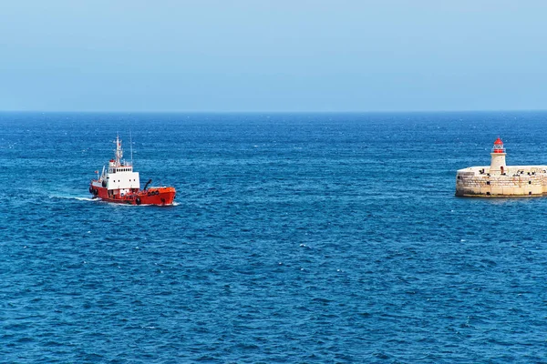 Dry cargo carrier at Breakwater at Fort Ricasoli of Kalkara