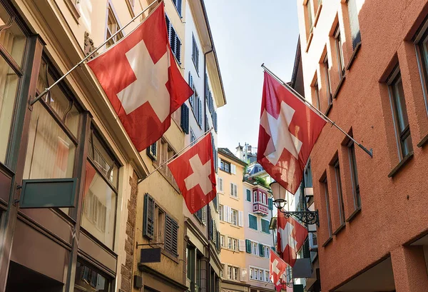 Flags in street in old city center of Zurich — Stock Photo, Image