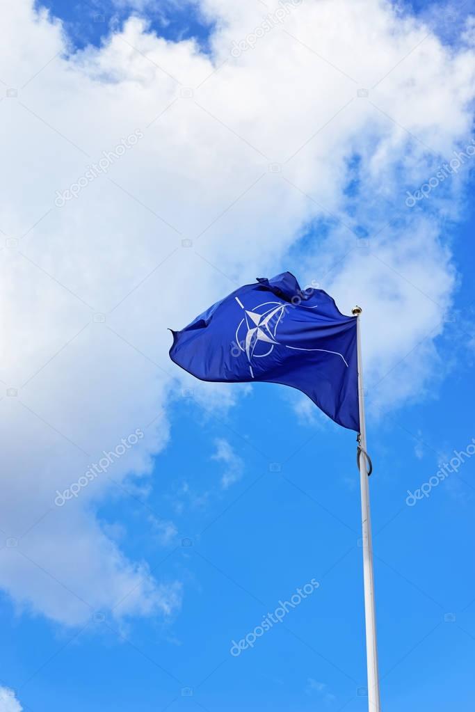 Flag of NATO waving by wind