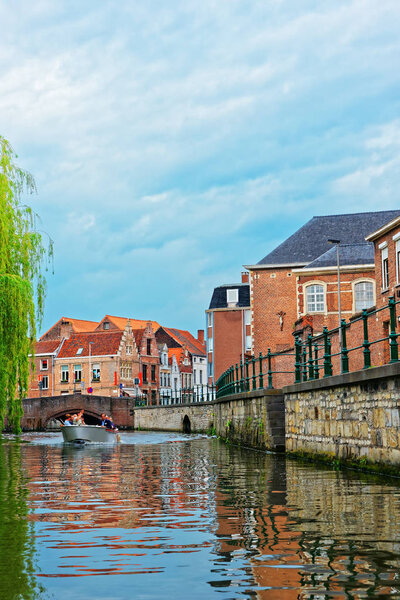 Tourists on Boat at Graslei in Lys River in Ghent