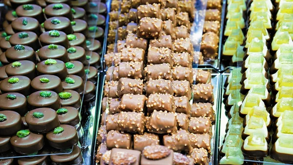 Collection of Swiss chocolate sweet with pistachio nuts and citr — Stock Photo, Image