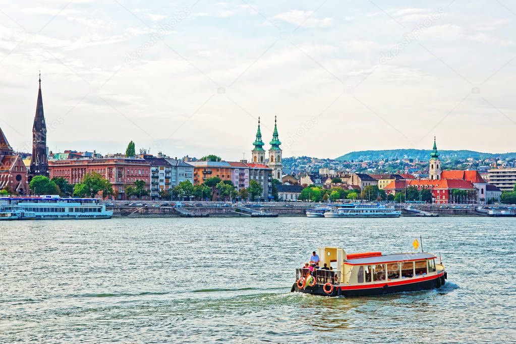 Ferry and Buda City with University Church Steeple at Danube