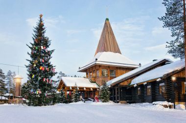 Santa Claus Village with Christmas tree Lapland clipart