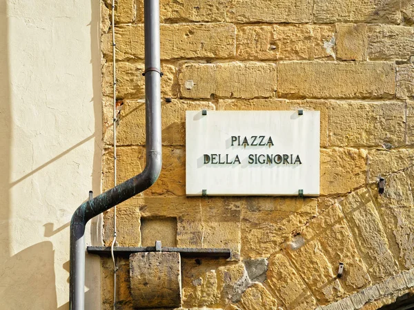 Cartel en la calle Piazza della Signoria en la pared de Florencia — Foto de Stock