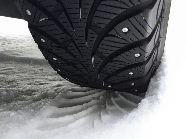 Closeup of car studded snow tire — Stock Photo, Image