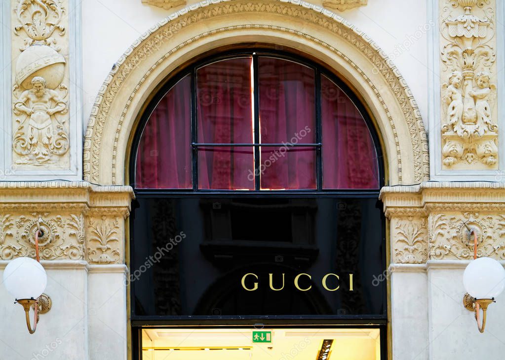 Milan, Italy - October 24, 2016: Gucci Sign on street shop window in Milan.