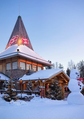 Santa Claus Office at Santa Village Finnish Lapland Scandinavia dusk clipart