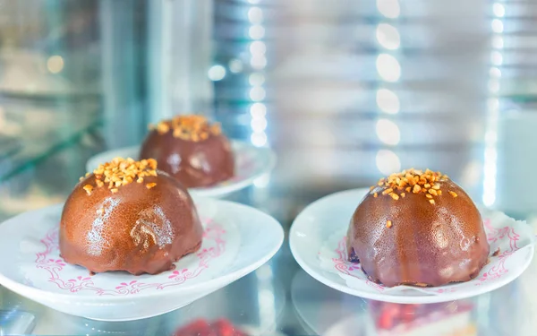 Milk chocolate dessert in fridge on display cafe Positano — Stock Photo, Image