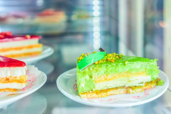 Pistachio dessert in fridge on display cafe Positano — Stock Photo, Image
