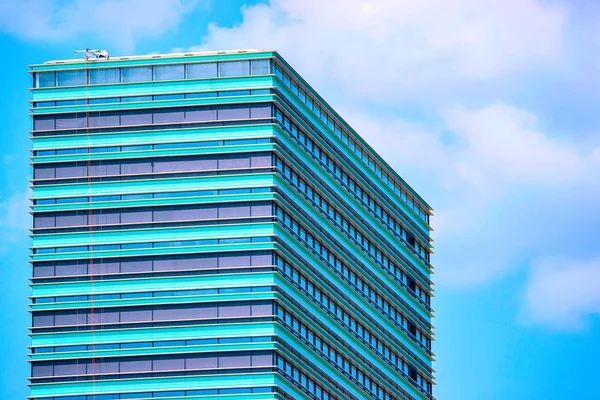 Fragment of modern office skyscraper at business district — Stock Photo, Image