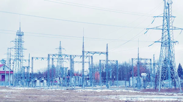 Electric transmission lines at snowy road of winter Rovaniemi