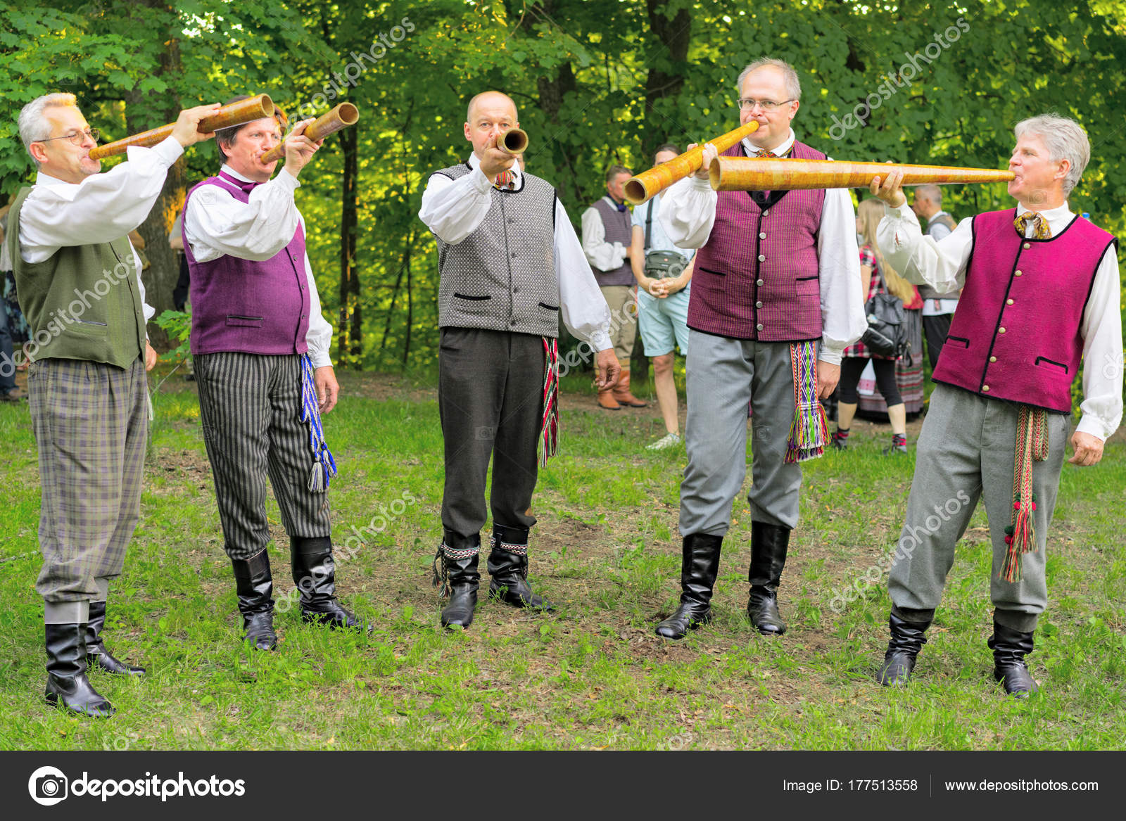 depositphotos_177513558-stock-photo-men-in-traditional-costumes-playing.jpg