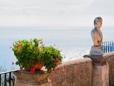 Sculpture and flowers at terrace in Ravello village clipart