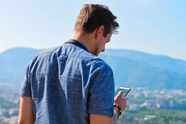 Man looking at mobile phone in Marina Grande Sorrento