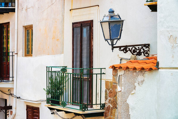 Balcony of a house in Cefalu old town, Palermo region, Sicily island in Italy