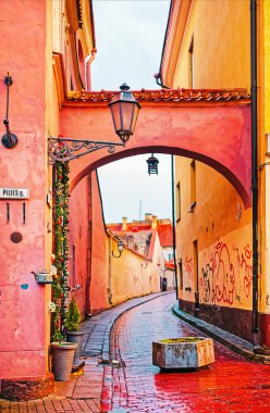 Arch in Pilies Street in the Old Town of Vilnius in Lithuania clipart