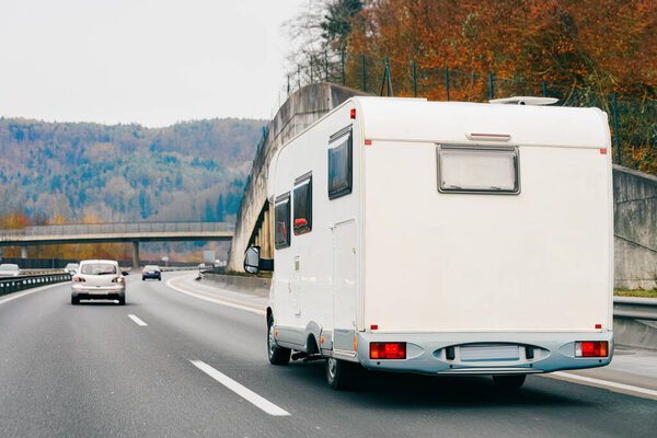 White Camper rv in road
