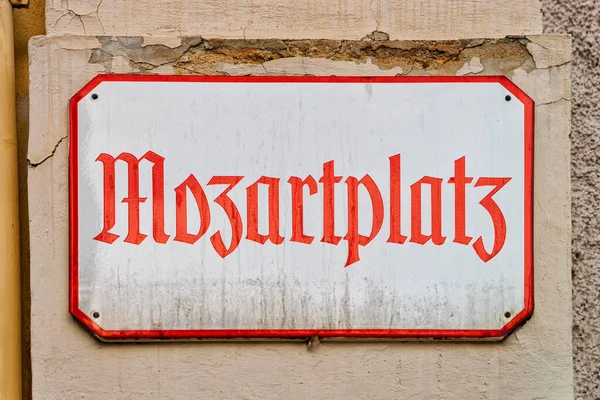Street name plate on wall on Mozartplatz Square of Salzburg