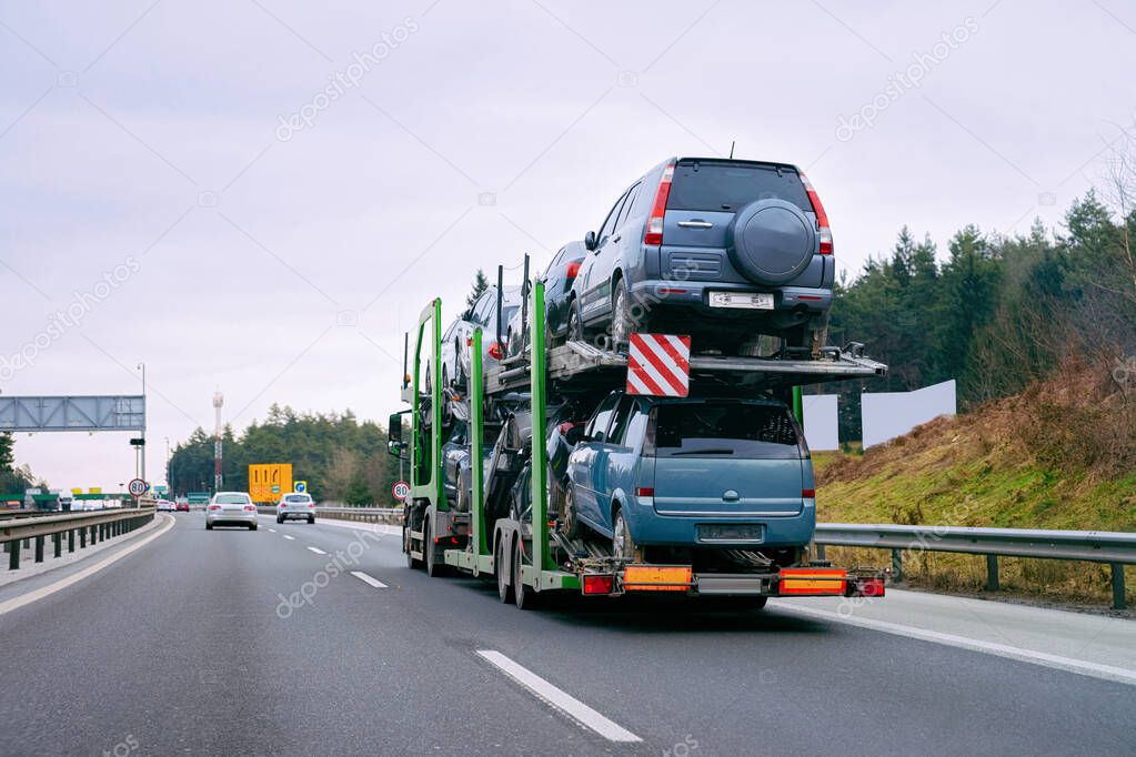 Cars carrier transporter truck in road Auto vehicles