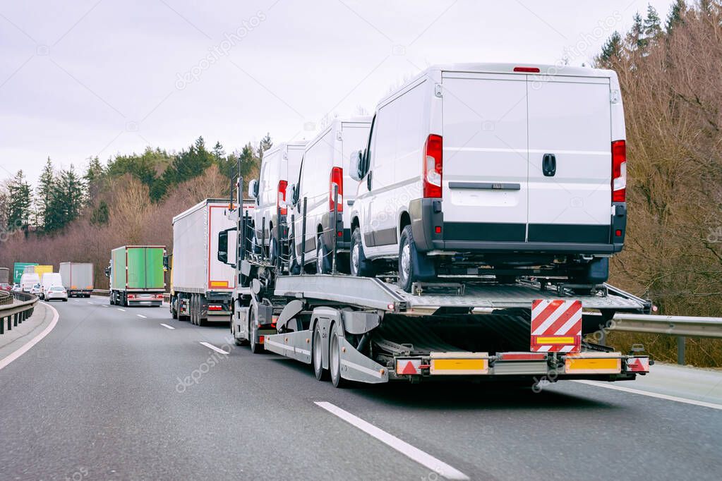 Minivan carrier transporter truck on road Auto vehicles
