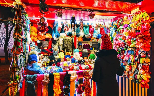 Colorful woolen clothes and consumer Riga Street Christmas Market new — Stock Photo, Image