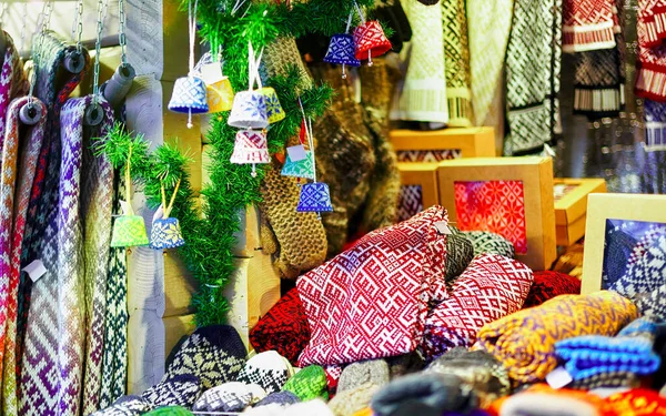 Ornamental warm clothes at stall during Riga Christmas market new — Stock Photo, Image