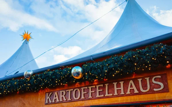 Kartofelhaus Potato house Sign plate Night Christmas Market Gendarmenmarkt Berlin reflex