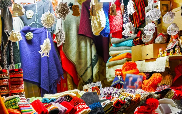 Stall with colorful woolen clothes at Riga Christmas market reflex — Stock Photo, Image