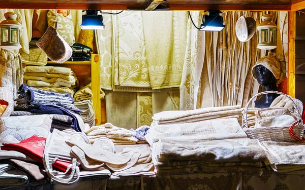 Mannequin head and linen clothes at the Riga Christmas market reflex