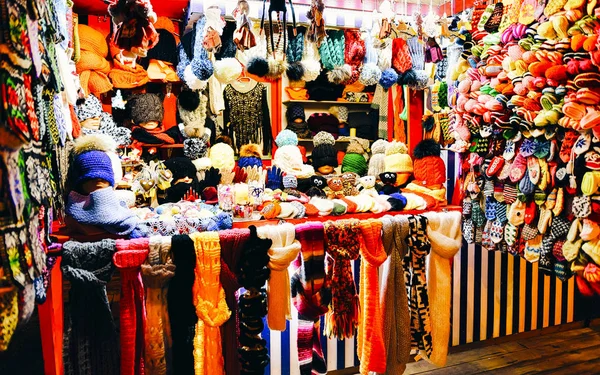 Colorful wool clothes Riga Street Christmas Market reflex — Stock Photo, Image