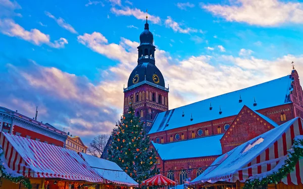 Christmas market in Riga filled with a unique atmosphere and surrounded by historical scenery reflex Stock Image