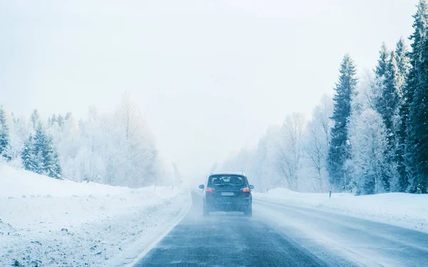 Car in a road a snowy winter Lapland reflex — Stock Photo, Image