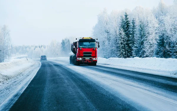 Truck on the Snowy winter Road in Finland Lapland reflex — Stock Photo, Image