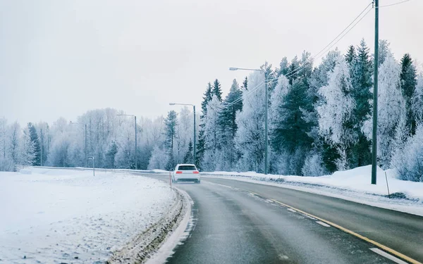 Car in a road in a snowy winter Lapland reflex — Stock Photo, Image