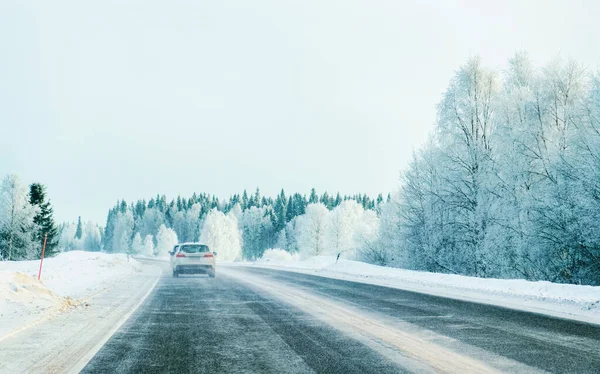 Landscape with car in road at snowy winter Lapland reflex — Stock Photo, Image